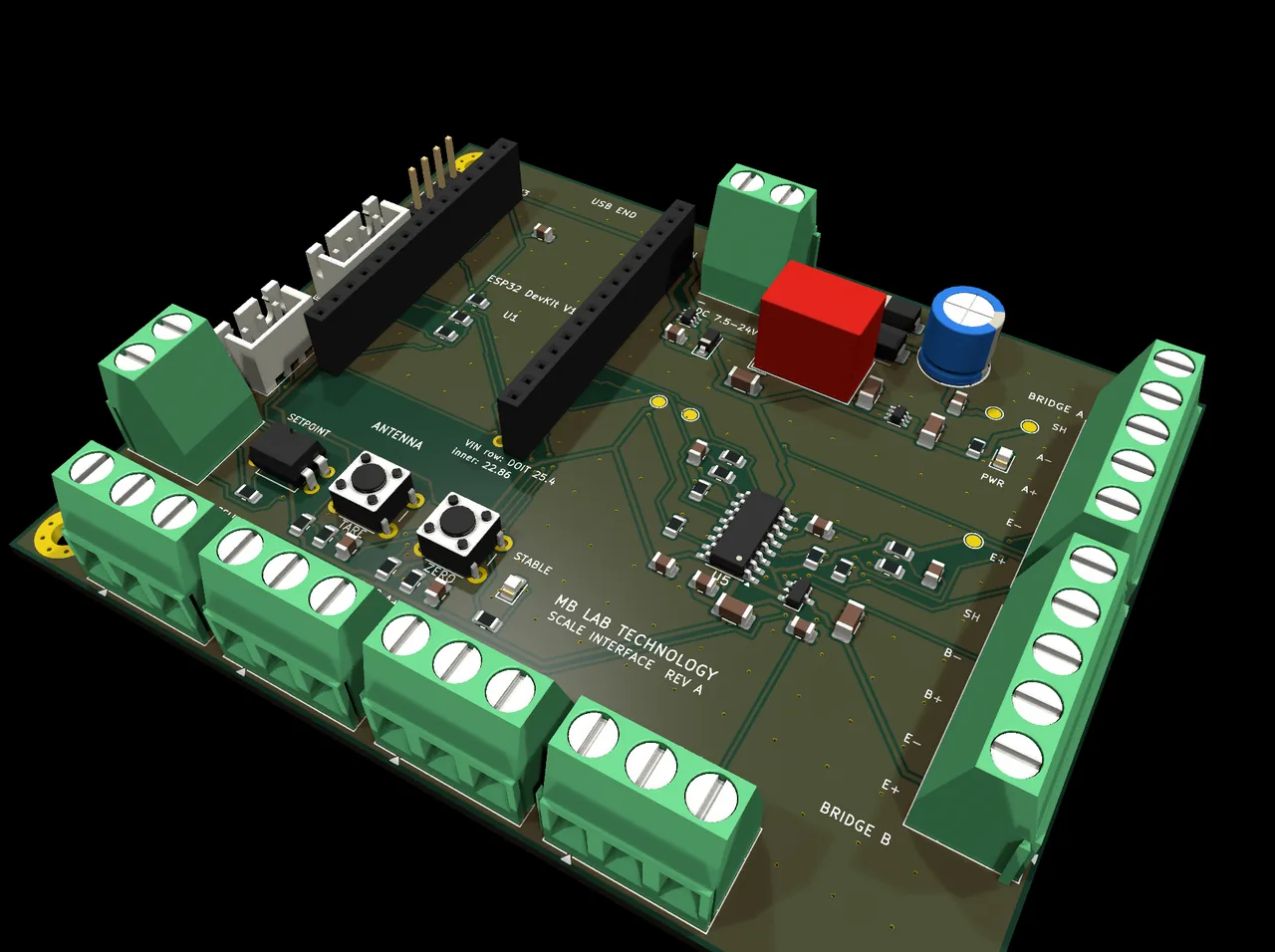 The four green terminal blocks along the front edge are the load cells, one each, labelled with the three wires a half-bridge cell brings; the two down the right are the full-bridge inputs. The two buttons are TARE and ZERO, where an operator can reach them.